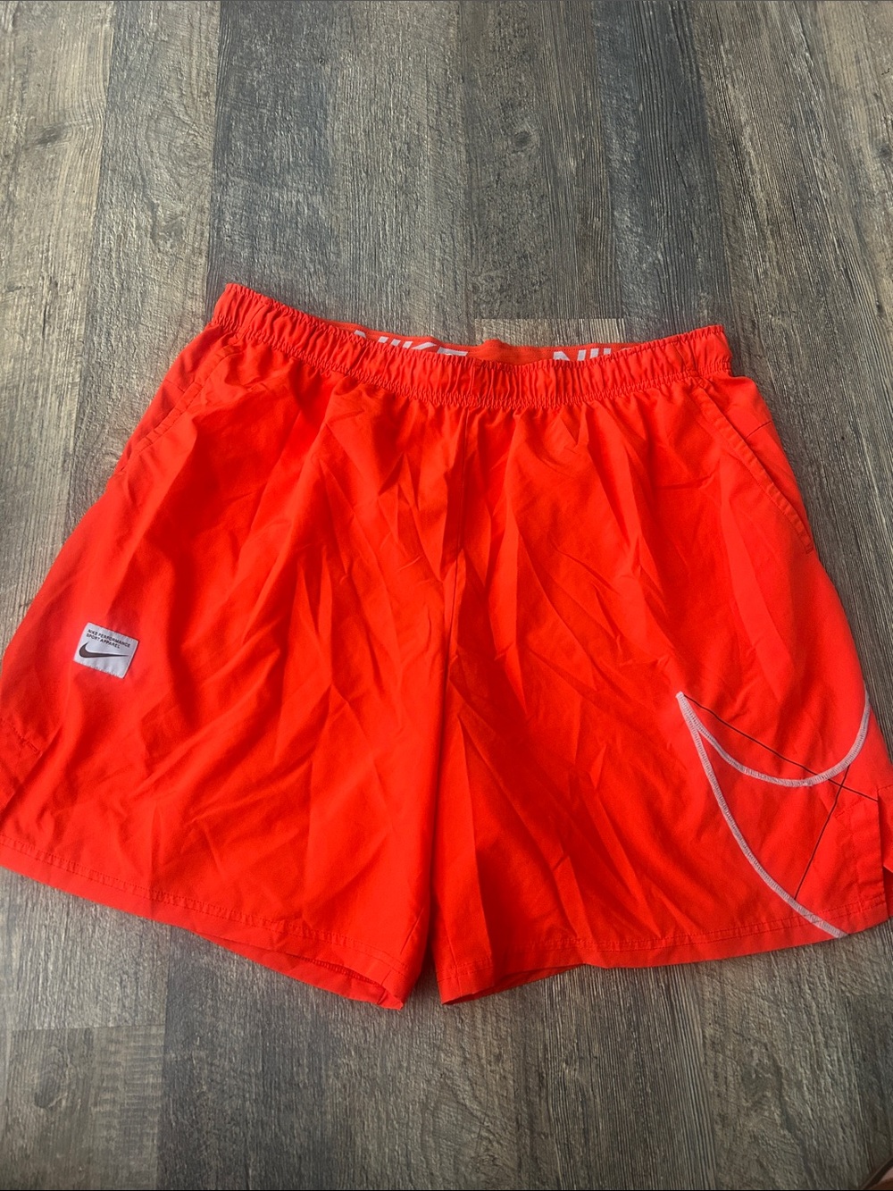 Nike Orange Elastic Waist Athletic Shorts with White Logo